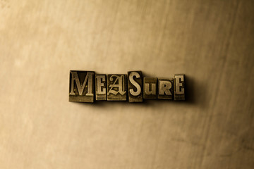 MEASURE - close-up of grungy vintage typeset word on metal backdrop. Royalty free stock - 3D rendered stock image.  Can be used for online banner ads and direct mail.