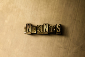 INFANTS - close-up of grungy vintage typeset word on metal backdrop. Royalty free stock - 3D rendered stock image.  Can be used for online banner ads and direct mail.