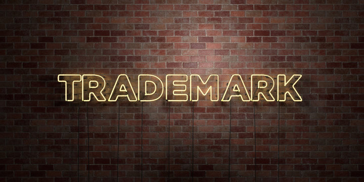 TRADEMARK - fluorescent Neon tube Sign on brickwork - Front view - 3D rendered royalty free stock picture. Can be used for online banner ads and direct mailers..
