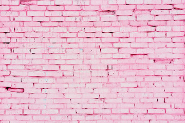 Old pink brick wall with cracks