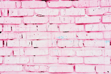 Old pink brick wall with cracks