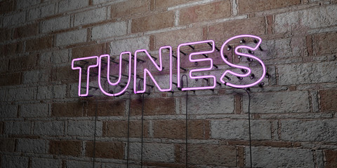 TUNES - Glowing Neon Sign on stonework wall - 3D rendered royalty free stock illustration.  Can be used for online banner ads and direct mailers..