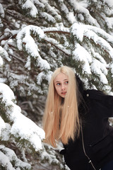 girl in a snowy winter forest. slum