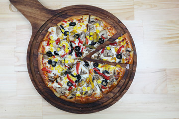 Fototapeta na wymiar mixed topping pizza ready to serve