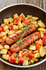 Grilled sausages with fresh rosemary and grilled potatoes