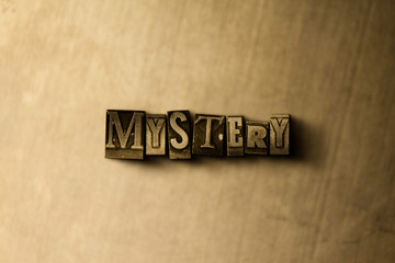 MYSTERY - close-up of grungy vintage typeset word on metal backdrop. Royalty free stock - 3D rendered stock image.  Can be used for online banner ads and direct mail.