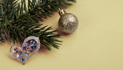  brooch with multi-colored crystals on a branch tree .New Year's still-life