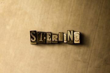 STERLING - close-up of grungy vintage typeset word on metal backdrop. Royalty free stock - 3D rendered stock image.  Can be used for online banner ads and direct mail.