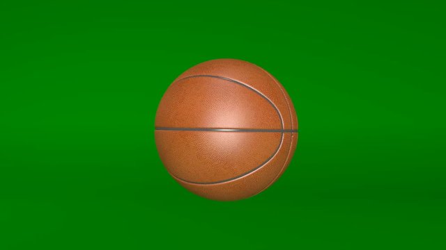 Basketball, spinning ball, sports equipment isolated on green background