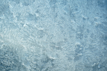 frost crystal on window glass in winter season