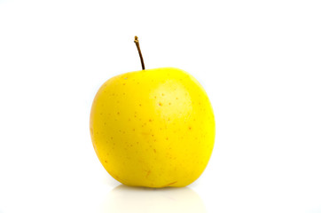 Golden apple close-up isolated on white background