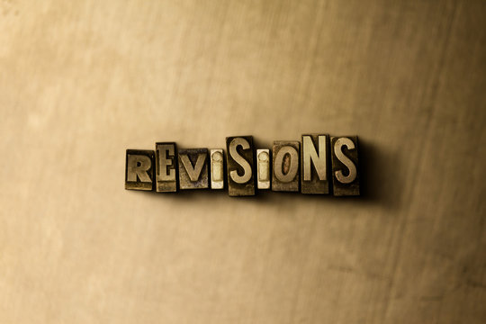 REVISIONS - close-up of grungy vintage typeset word on metal backdrop. Royalty free stock - 3D rendered stock image.  Can be used for online banner ads and direct mail.