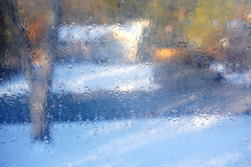 glass window with rain drop and outside winter residential scenery