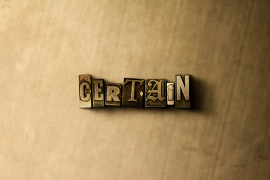 CERTAIN - close-up of grungy vintage typeset word on metal backdrop. Royalty free stock - 3D rendered stock image.  Can be used for online banner ads and direct mail.