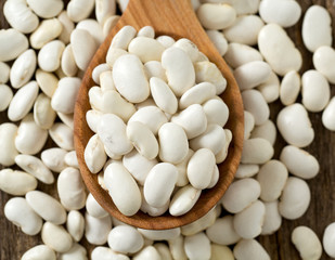 white butter beans on wooden surface