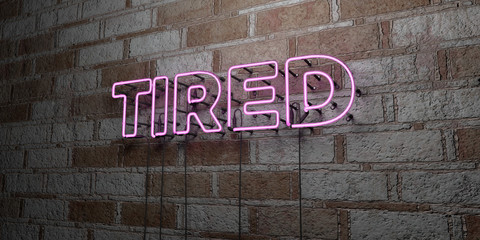 TIRED - Glowing Neon Sign on stonework wall - 3D rendered royalty free stock illustration.  Can be used for online banner ads and direct mailers..