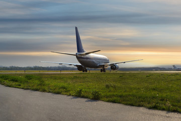 Fototapeta na wymiar Airplane on the runway after landing