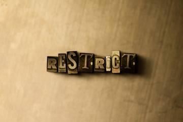 RESTRICT - close-up of grungy vintage typeset word on metal backdrop. Royalty free stock - 3D rendered stock image.  Can be used for online banner ads and direct mail.