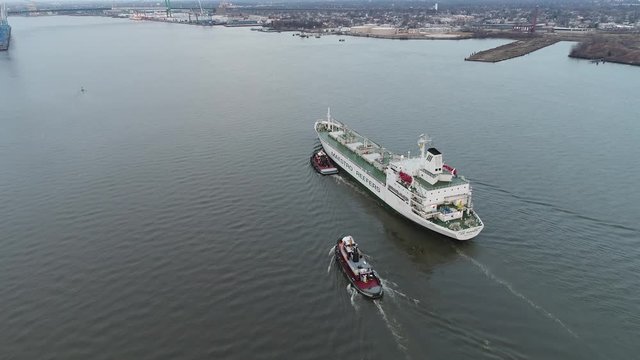 Aerial Footage of Tugboat's Guiding a Reefer into Port Philadelphia PA