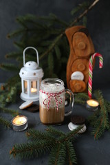 Christmas hot chocolate with ornaments and candy cane. Christmas and New Year decorations