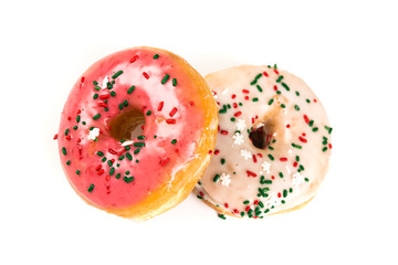Raised frosted donuts isolated on a white background