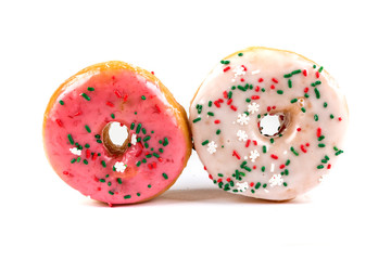 Raised frosted donuts isolated on a white background