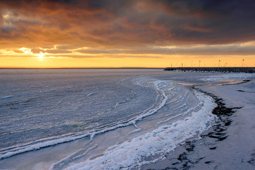  Frozen Bay of Puck at sunset time.  Poland, Europe.