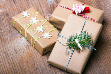Christmas presents on wooden background, retro style with copy space