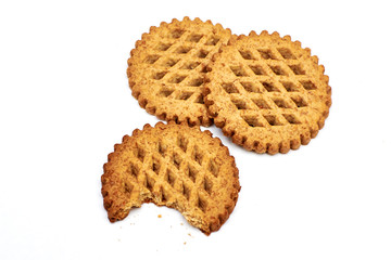Cookies with bran with a half-eaten piece on a white background