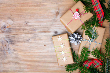 Christmas presents on wooden background, retro style with copy space