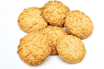 oatmeal cookies with sesame seeds on white background