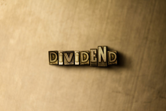 DIVIDEND - close-up of grungy vintage typeset word on metal backdrop. Royalty free stock - 3D rendered stock image.  Can be used for online banner ads and direct mail.