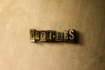 CLOTHES - close-up of grungy vintage typeset word on metal backdrop. Royalty free stock - 3D rendered stock image.  Can be used for online banner ads and direct mail.