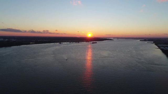 Aerial Footage of Tugboats  and Barge on Delaware River Philadelphia PA Sunset