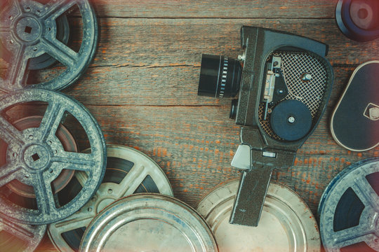 Old movie camera and film reel