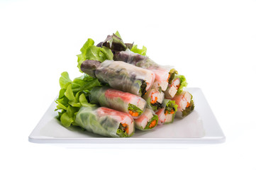 Fresh vegetable salads roll in noodle tube isolated on white bac