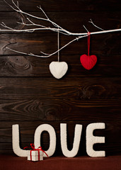 Valentine's day concept. Letters LOVE and hearts made of yarn on