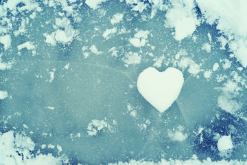 Heart from snow on ice. Snow Heart. Love concept. Valentine background.