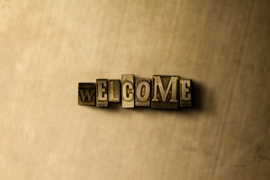 WELCOME - close-up of grungy vintage typeset word on metal backdrop. Royalty free stock - 3D rendered stock image.  Can be used for online banner ads and direct mail.
