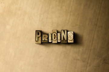 PRICING - close-up of grungy vintage typeset word on metal backdrop. Royalty free stock - 3D rendered stock image.  Can be used for online banner ads and direct mail.