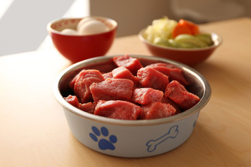 Healthy dog food on wooden background