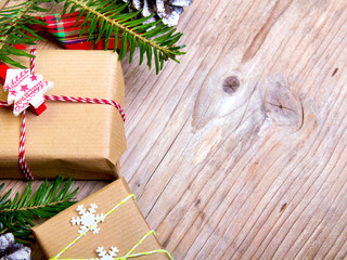 Christmas presents on wooden background, retro style with copy space
