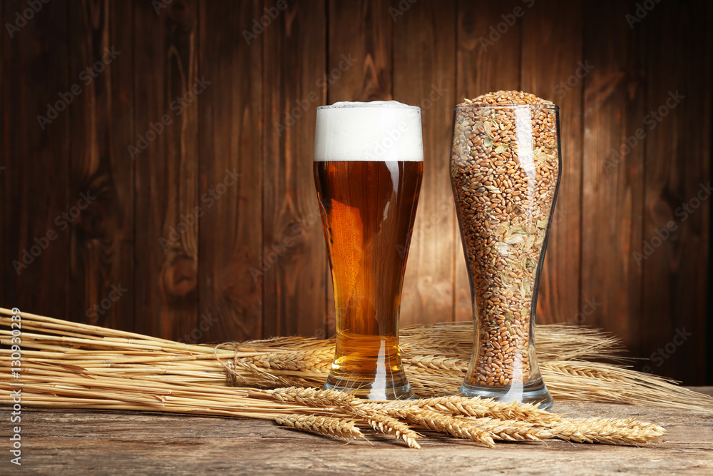 Canvas Prints glasses of beer and seeds with spikes on wooden background