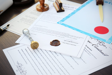 Old notarial wax seal and stamp on document, closeup