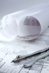 Architectural plans, compass and ruler on the desk
