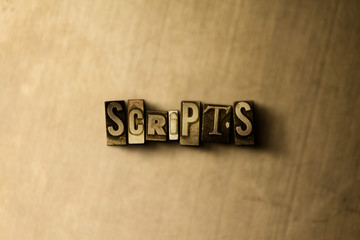 SCRIPTS - close-up of grungy vintage typeset word on metal backdrop. Royalty free stock - 3D rendered stock image.  Can be used for online banner ads and direct mail.