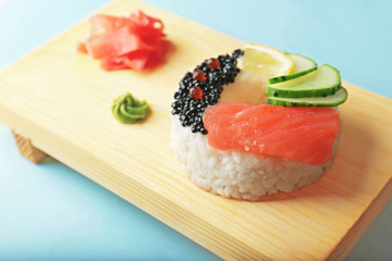 Sushi doughnut on wooden stand