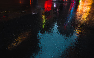NYC streets after rain with reflections on wet asphalt