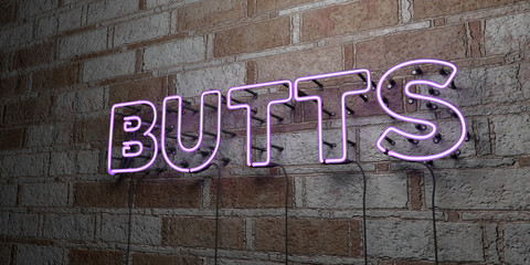 BUTTS - Glowing Neon Sign on stonework wall - 3D rendered royalty free stock illustration.  Can be used for online banner ads and direct mailers..