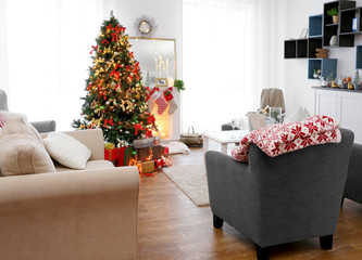 Cozy Christmas interior of living room with beautiful fir tree